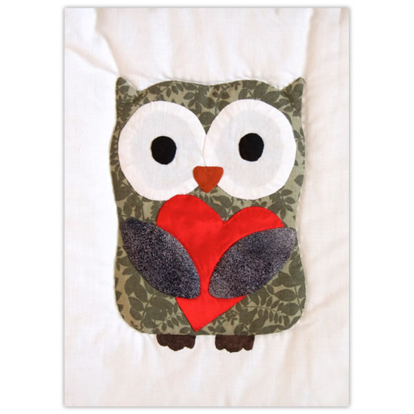 Quilted owl holding a heart