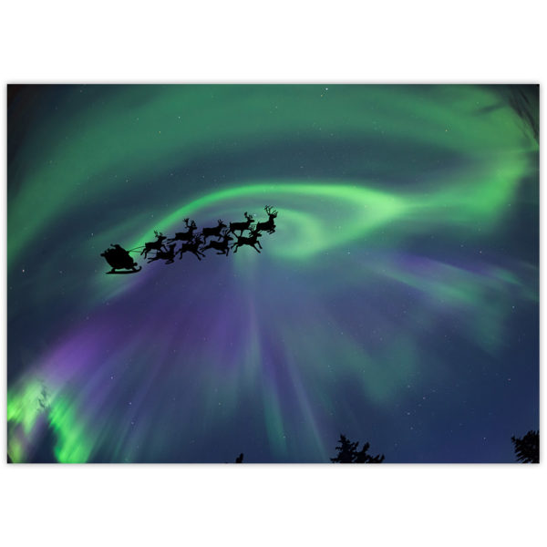 Santa and his reindeer fly through the sky with a northern lights backdrop
