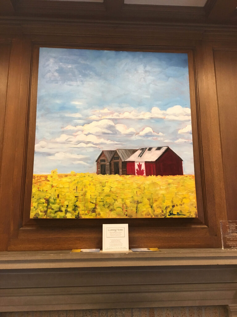 painting of Canada Flag granary in field of yellow canola